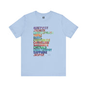 Light blue t-shirt with colorful text design on a white background