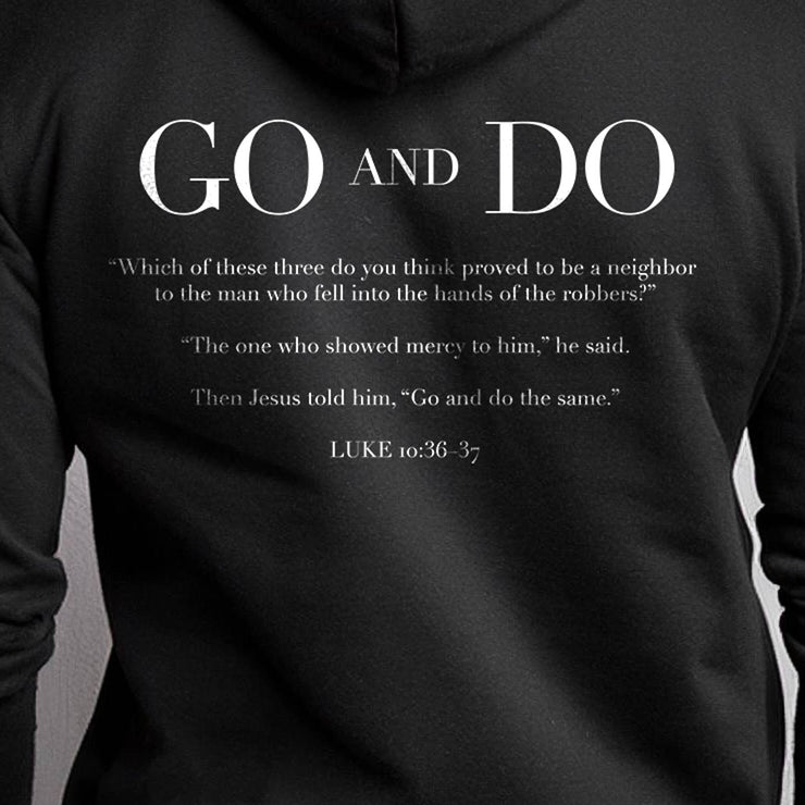 Black pullover hoodie with Go and Do graphic based on Luke 10:36