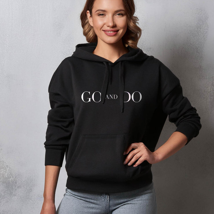 Black pullover hoodie with Go and Do graphic based on Luke 10:36