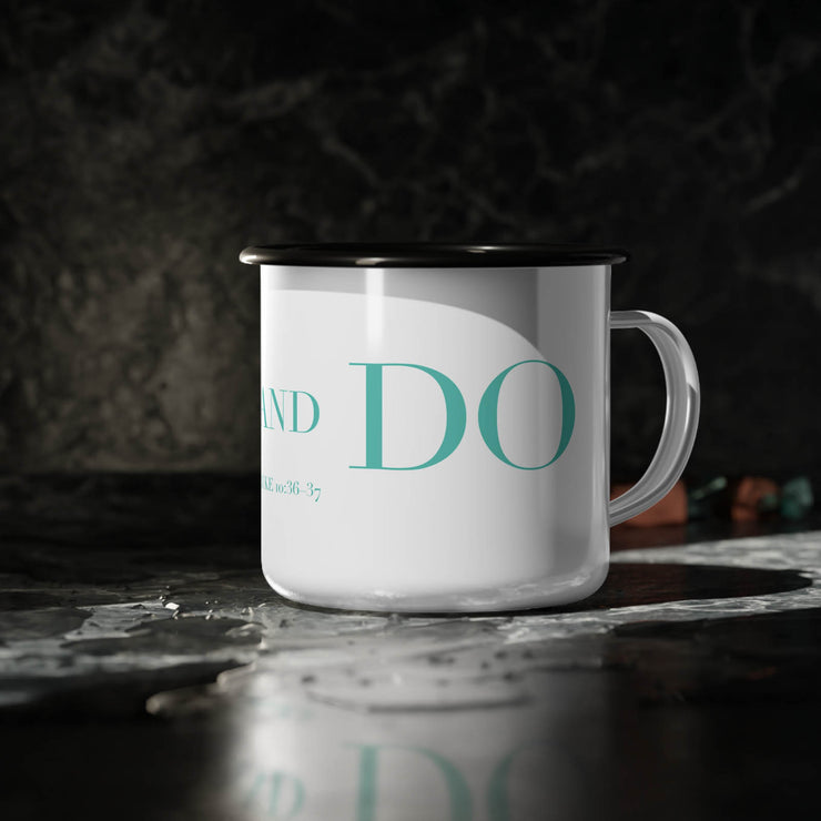 White campsite mug with GO and DO graphic based on Luke 10:36