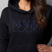 Black hoodie on woman with 'MAMA LOOK!' graphic