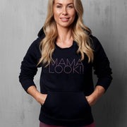 Black hoodie on woman with 'MAMA LOOK!' graphic
