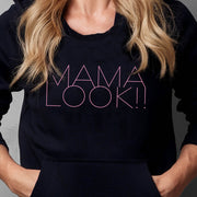 Black hoodie on woman with 'MAMA LOOK!' graphic
