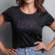 Woman wearing a black t-shirt with 'MAMA LOOK!!' graphic