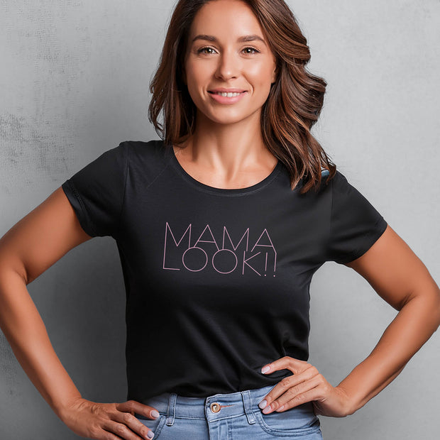 Woman wearing a black t-shirt with 'MAMA LOOK!!' graphic