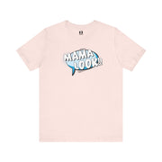 Pink t-shirt with 'MAMA LOOK' text on a white background