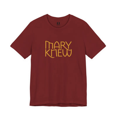 Maroon t-shirt with 'MARY KNEW' text in gold on a white background