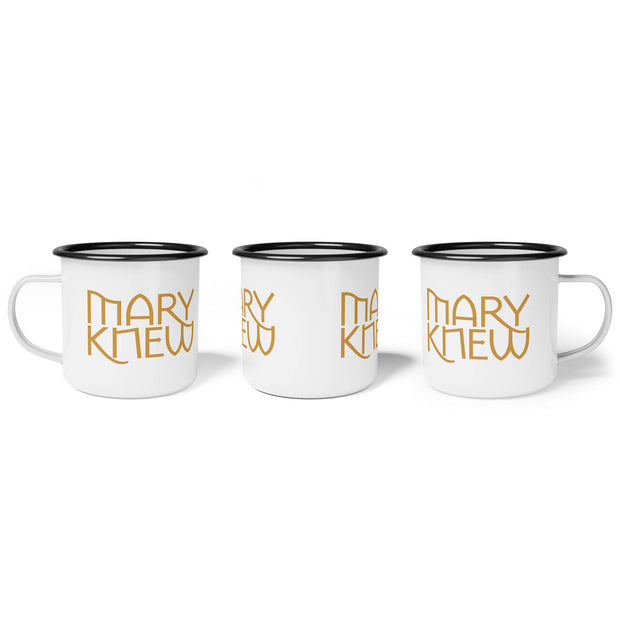 White mug with black rim and text 'Mary Knew' graphic