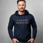 Man wearing a navy hoodie with 'The Pater Familias' text on a gray background