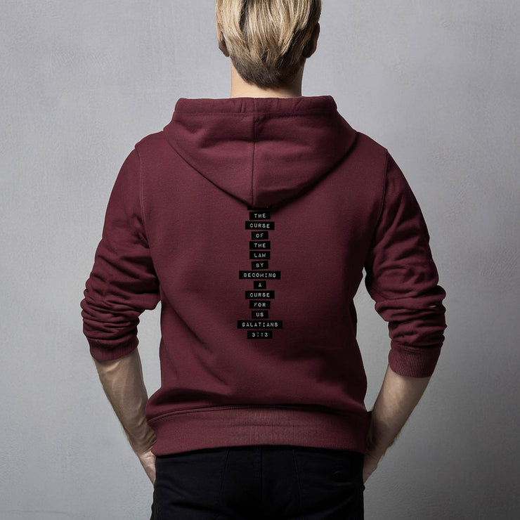 Maroon pullover hoodie with Redeemed graphic based on Galatians 3:13