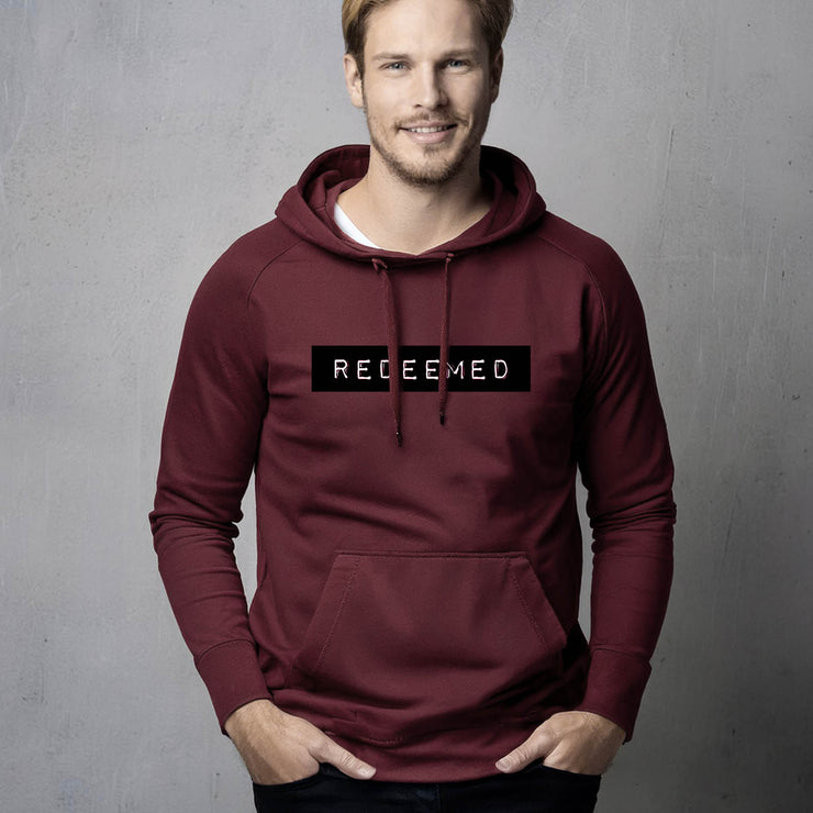 Maroon pullover hoodie with Redeemed graphic based on Galatians 3:13
