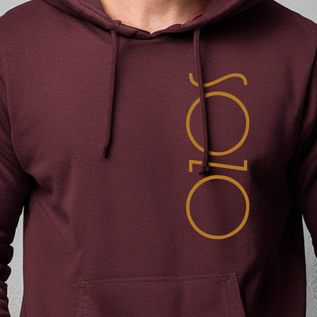 Maroon hoodie with Sozo in maize on man