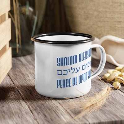 White mug with blue text 'Shalom Aleichem' and 'Peace Be Upon You' on a wooden surface
